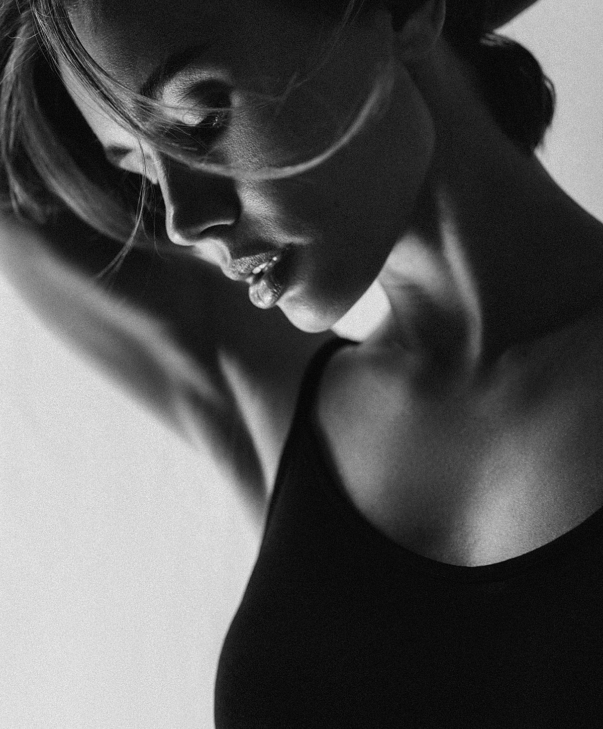 Profile portrait of a woman in black and white.