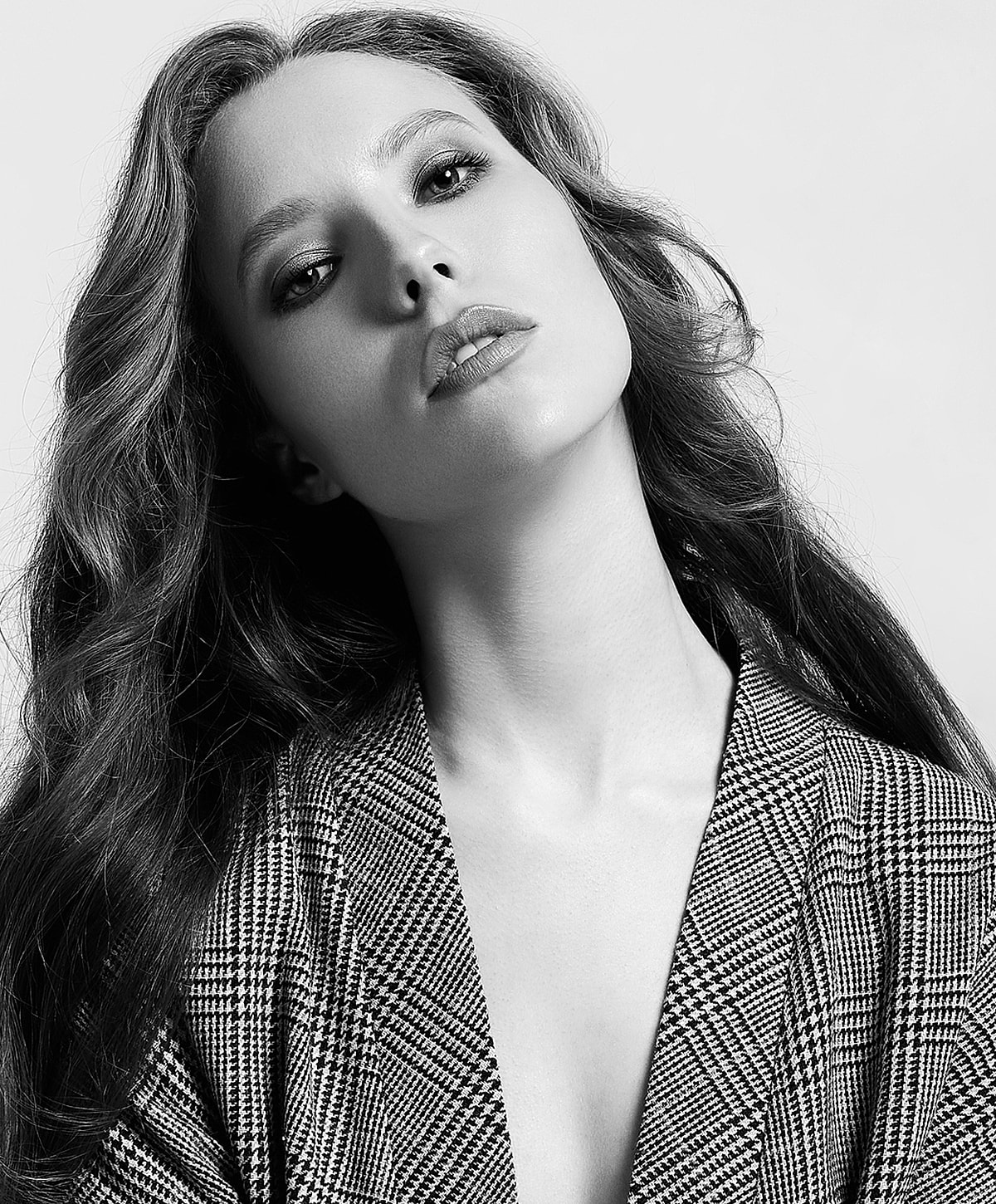 Black and white portrait of a confident woman.